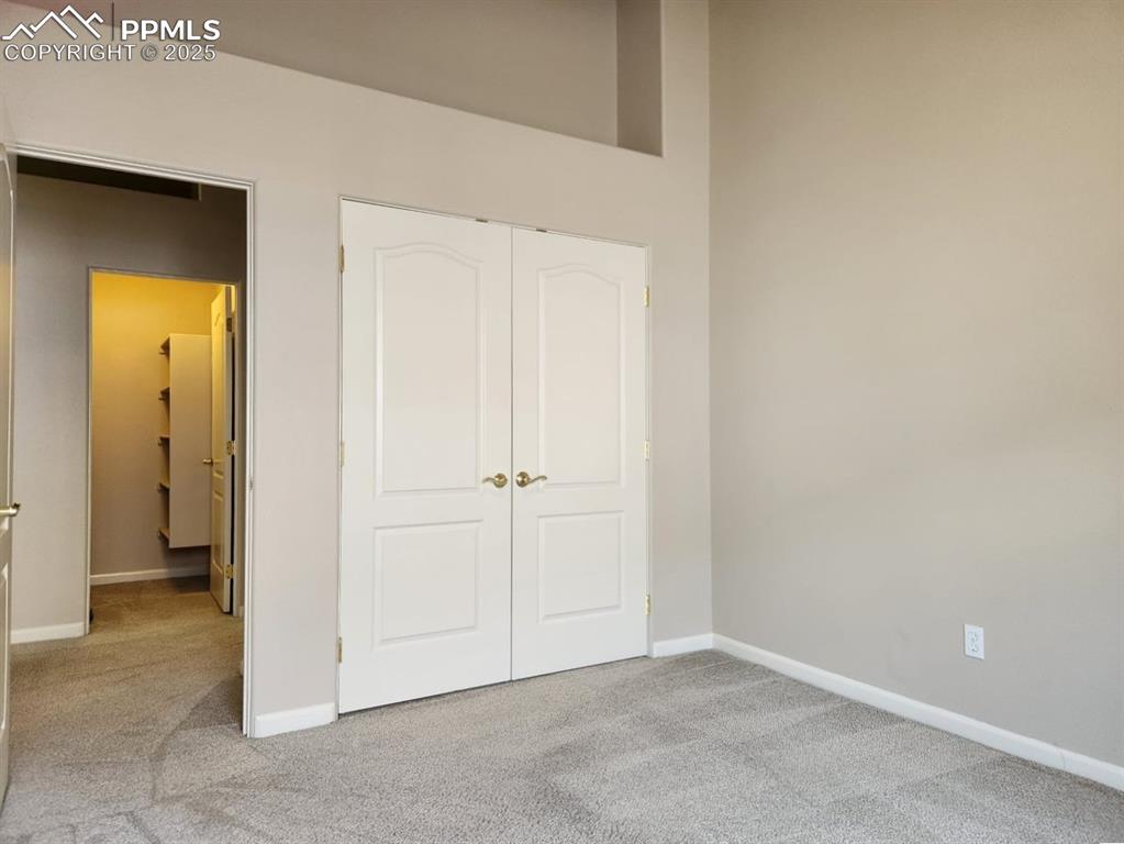 Image 18 of 34: Unfurnished bedroom featuring carpet flooring and a closet