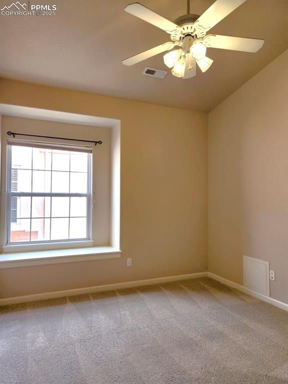 Image 19 of 34: Carpeted empty room with baseboards and a ceiling fan