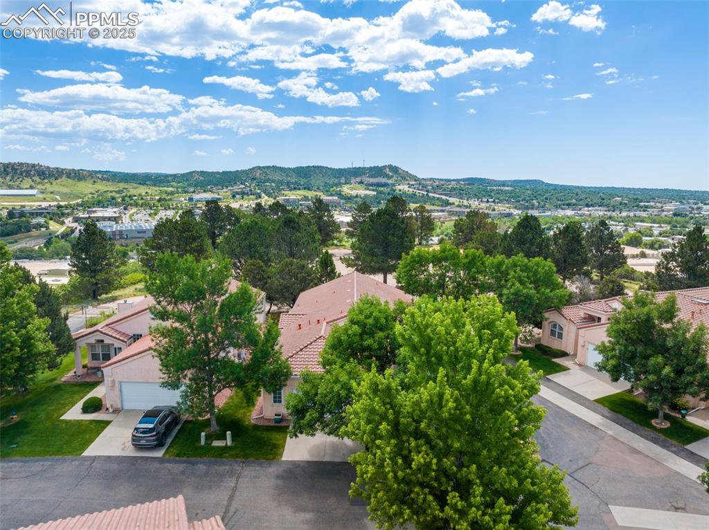 Image 24 of 34: Aerial perspective of suburban area featuring mountains