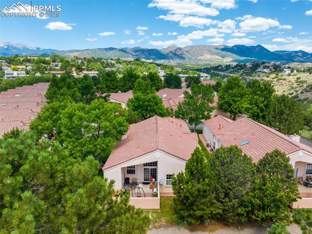 Image 28 of 34: Aerial perspective of suburban area with mountains