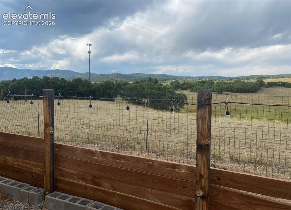 Image 10 of 11: BACKS TO OPEN SPACE WITH MOUNTAIN VIEWS
