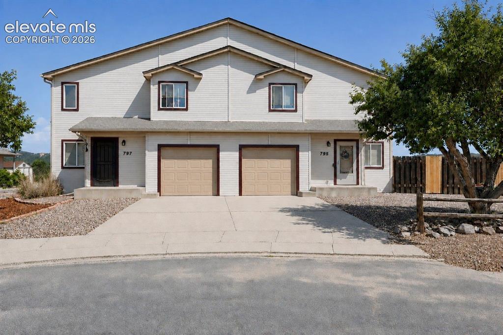 Image 11 of 11: FRONT OF DUPLEX - EAST SIDE IS 