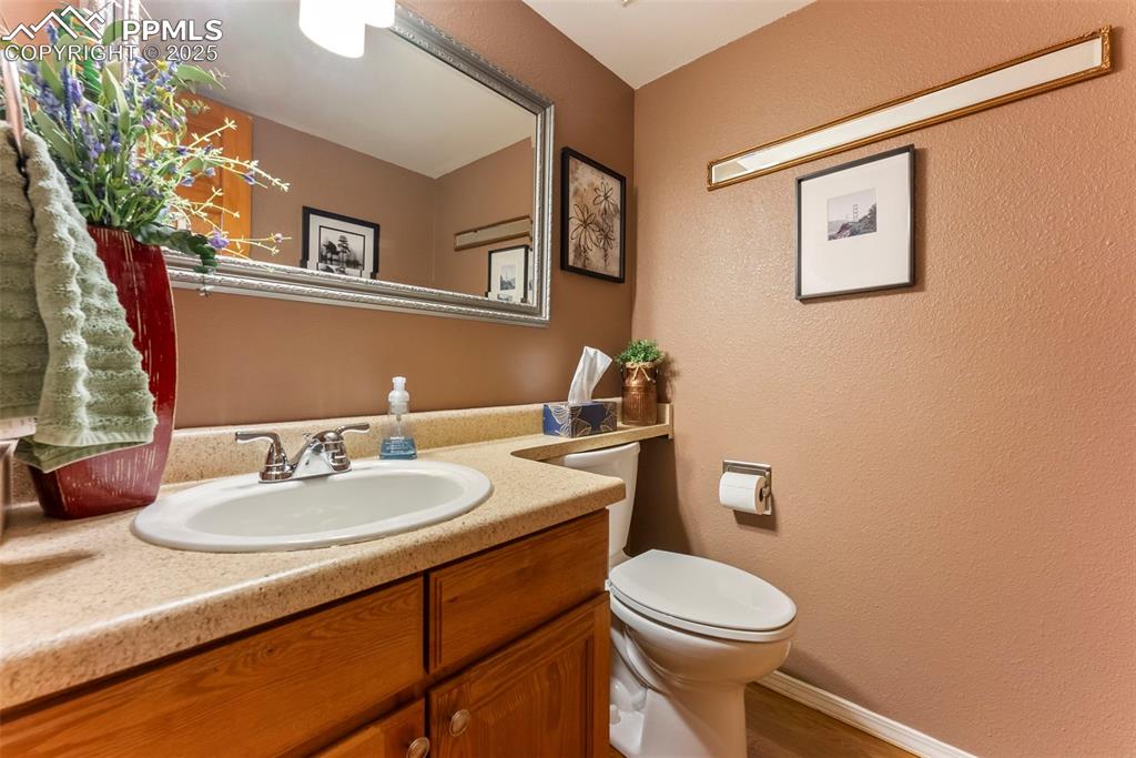 Image 22 of 50: Bathroom featuring a textured wall and vanity