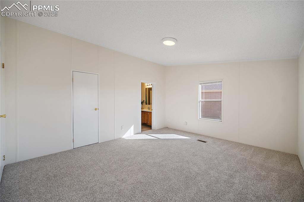 Image 10 of 34: Attached bath and walk in closet
