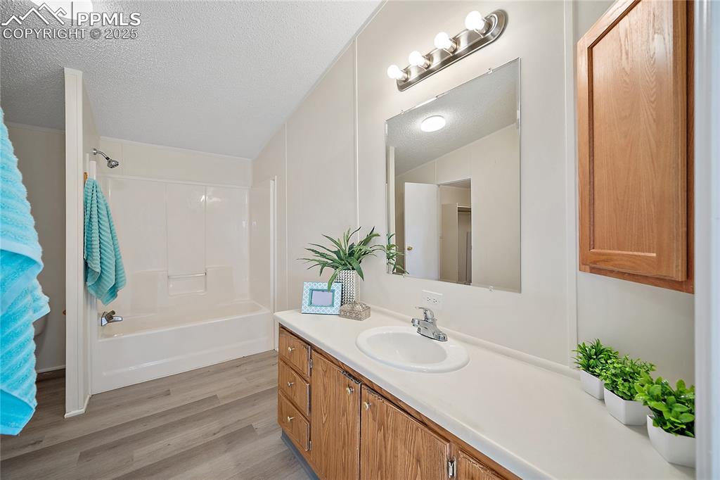 Image 11 of 34: Primary bathroom with new flooring. 