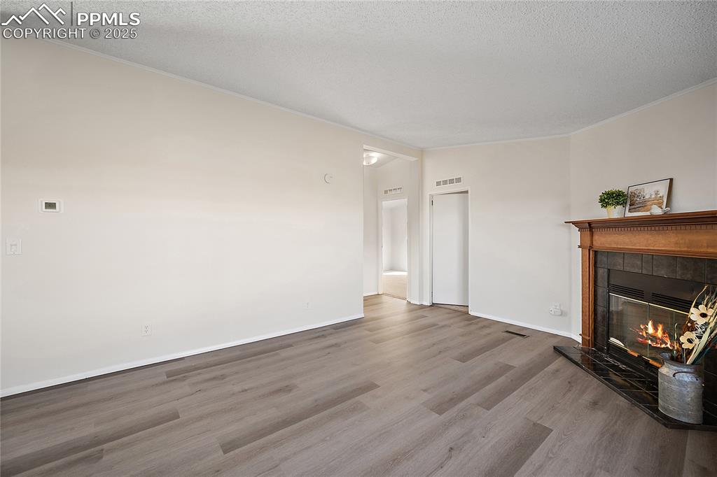 Image 23 of 34: New laminate flooring extends to the family room. 