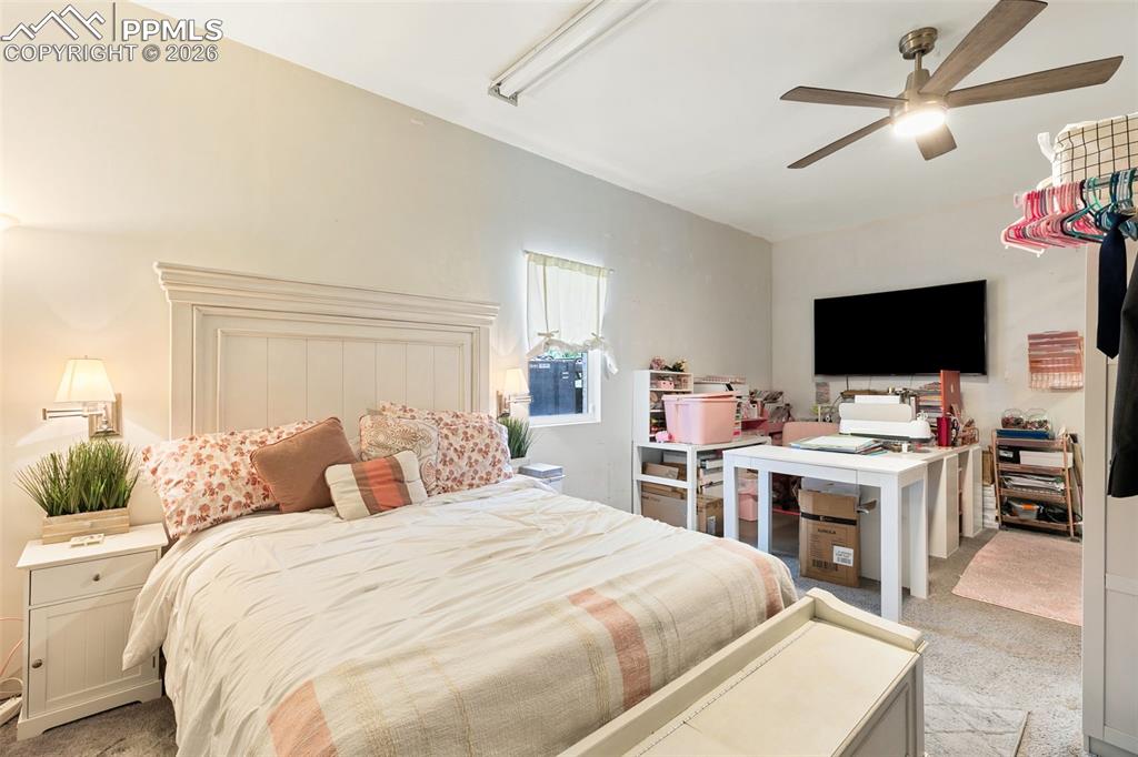 Image 17 of 38: Bedroom featuring light carpet and ceiling fan