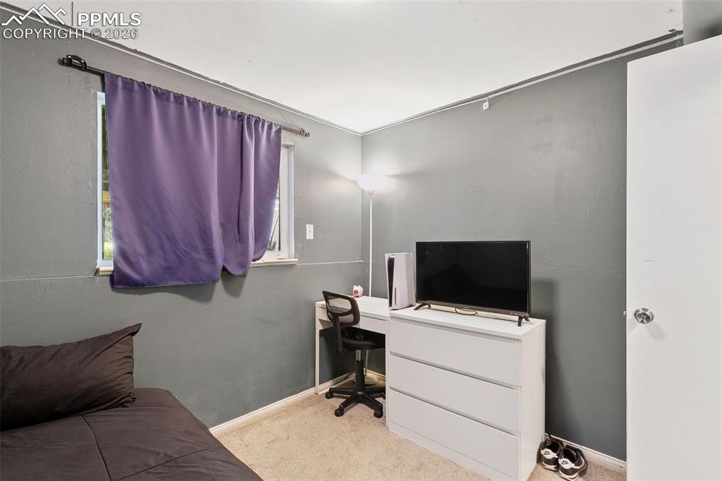 Image 27 of 38: Office featuring carpet flooring and baseboards