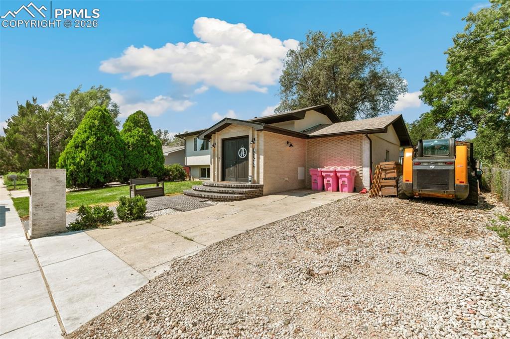 Image 3 of 38: View of front of property featuring brick siding