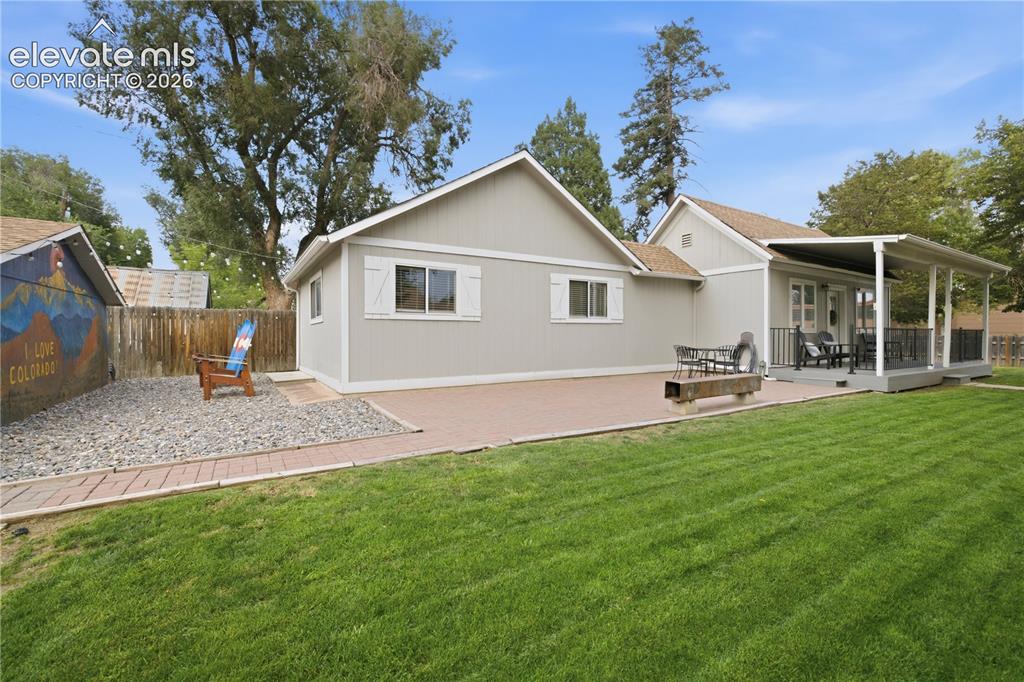 Image 5 of 42: Grass yard with sprinkler system