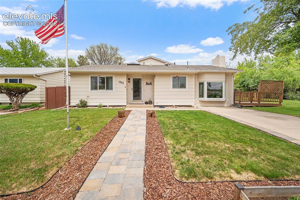 Image 1 of 44: Ranch-style residence featuring a pale yellow exterior and a bay window