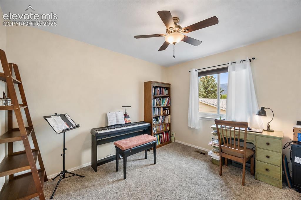 Image 18 of 44: Carpeted room featuring a ceiling fan with integrated lighting, a built-in