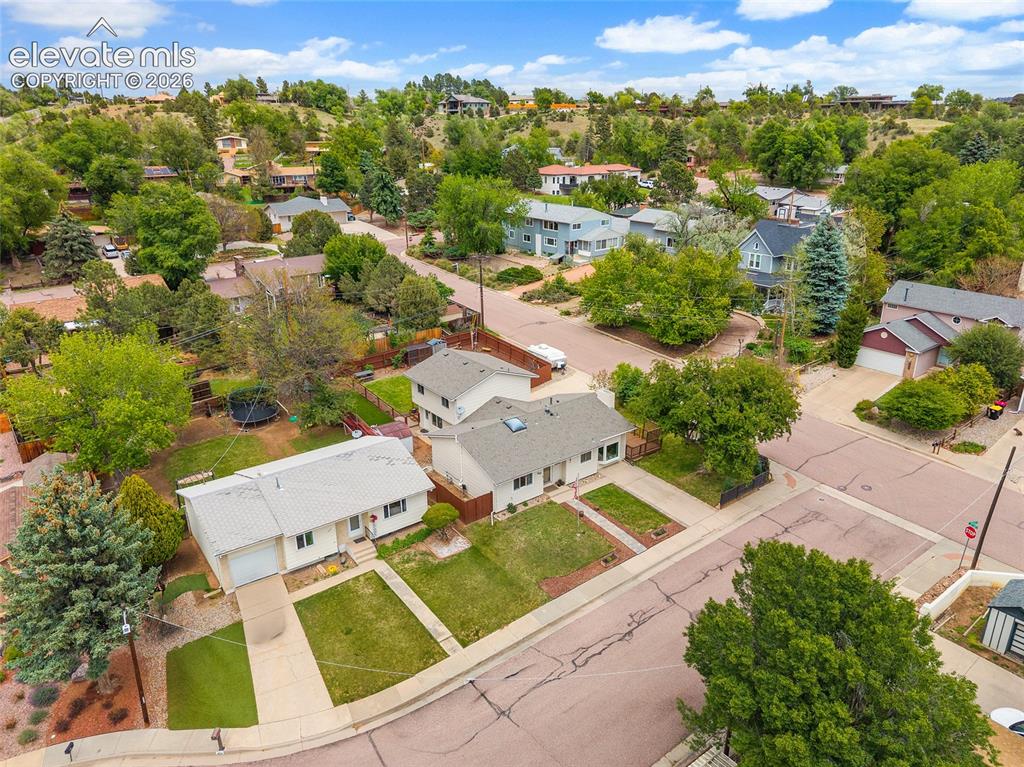 Image 37 of 44: Single-story residence featuring a white exterior, attached garage, and a l