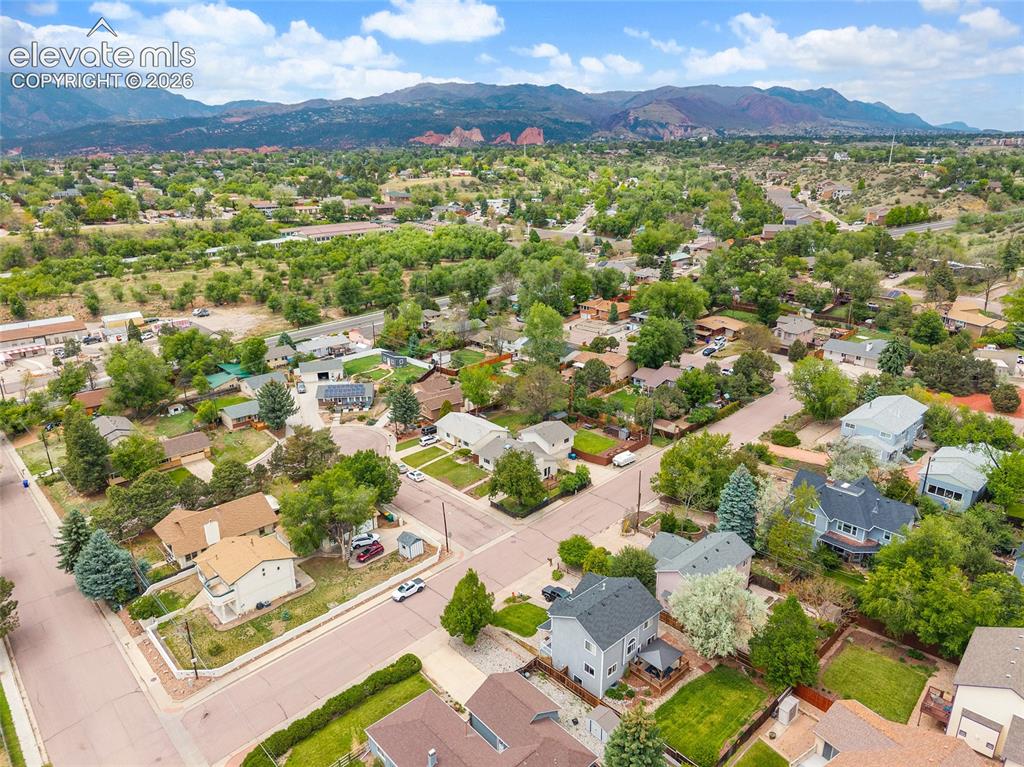 Image 39 of 44: Aerial perspective featuring a residential neighborhood with mature trees a