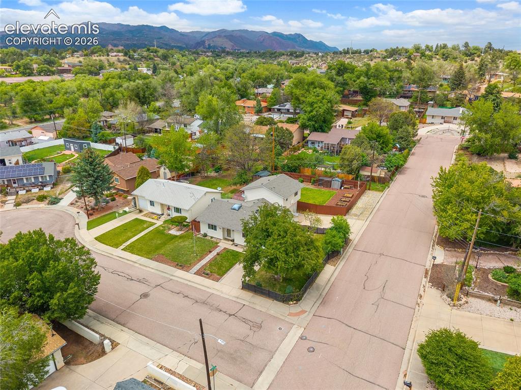 Image 41 of 44: Residential neighborhood with established homes and mature trees, featuring
