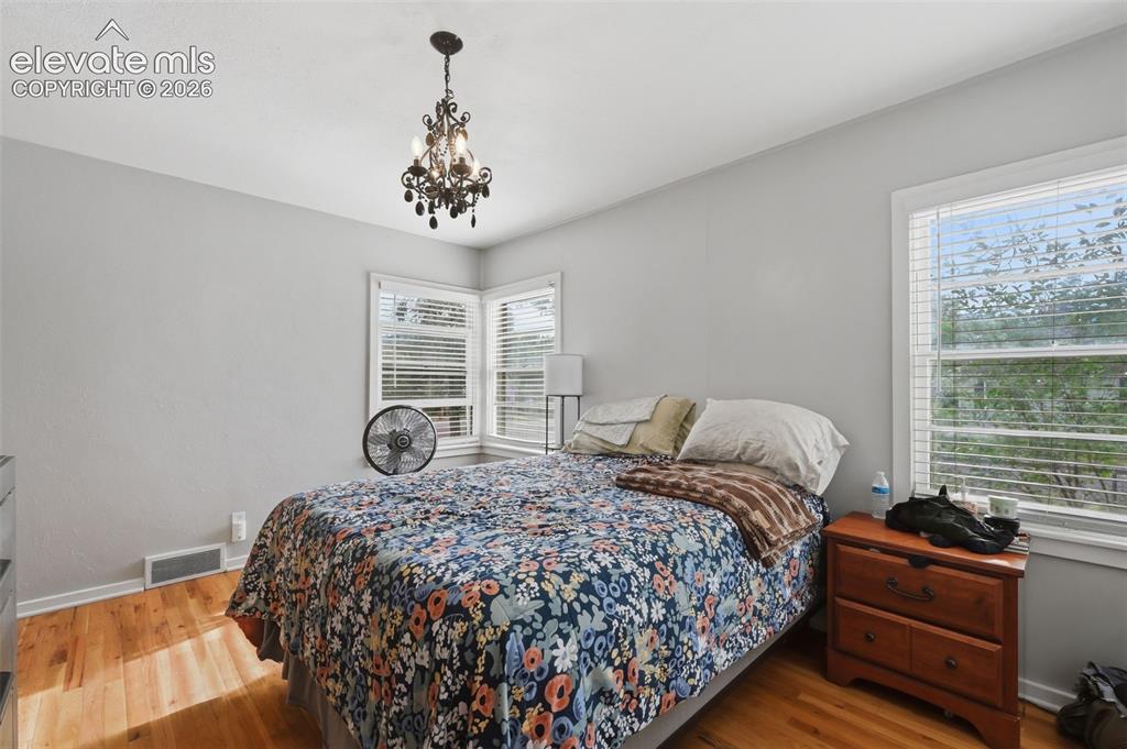 Image 17 of 32: Hardwood flooring complemented by light-toned walls