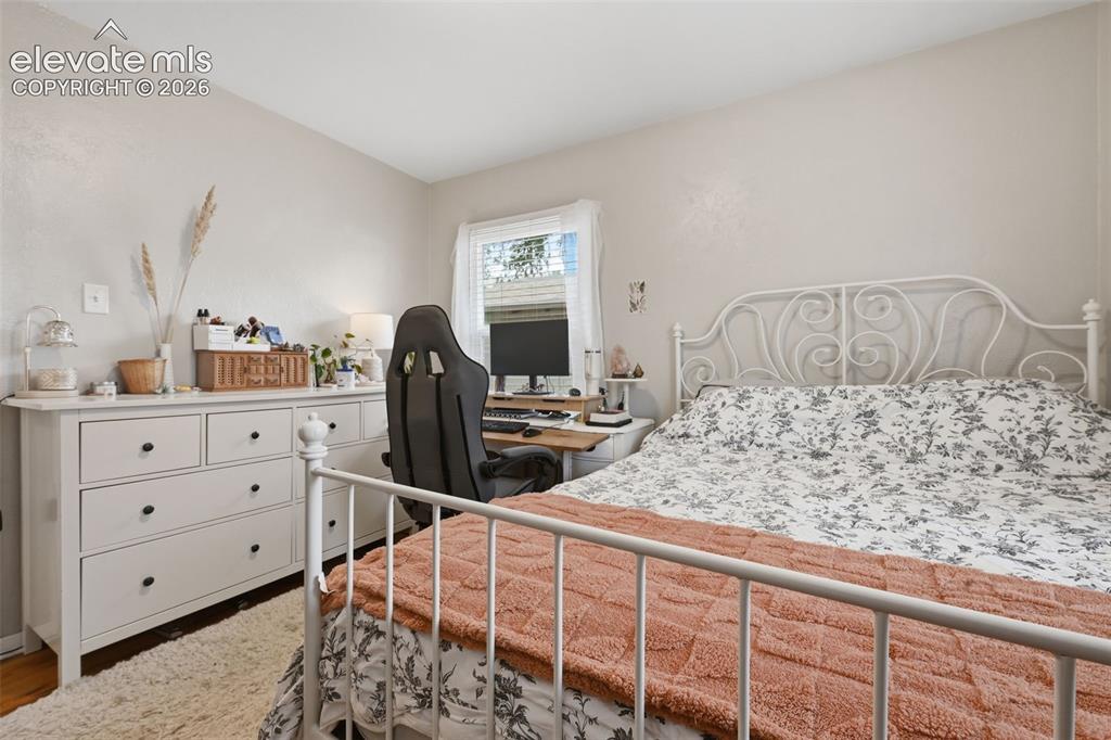 Image 25 of 32: Neutral paint finishes, window with natural illumination, and wood-finish f