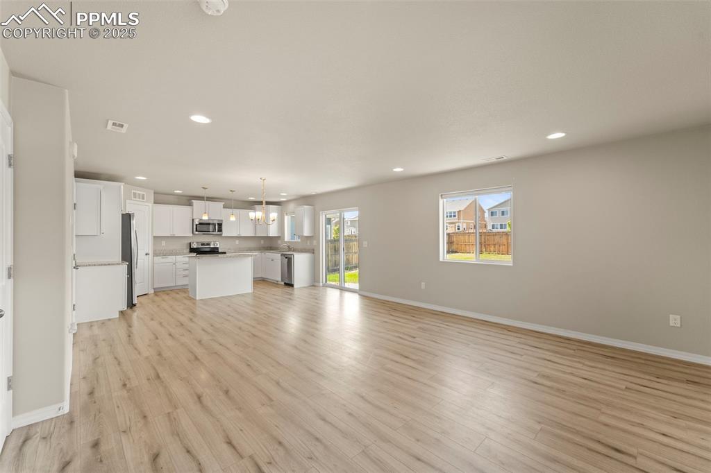 Image 15 of 35: Unfurnished living room with recessed lighting and light wood-type flooring
