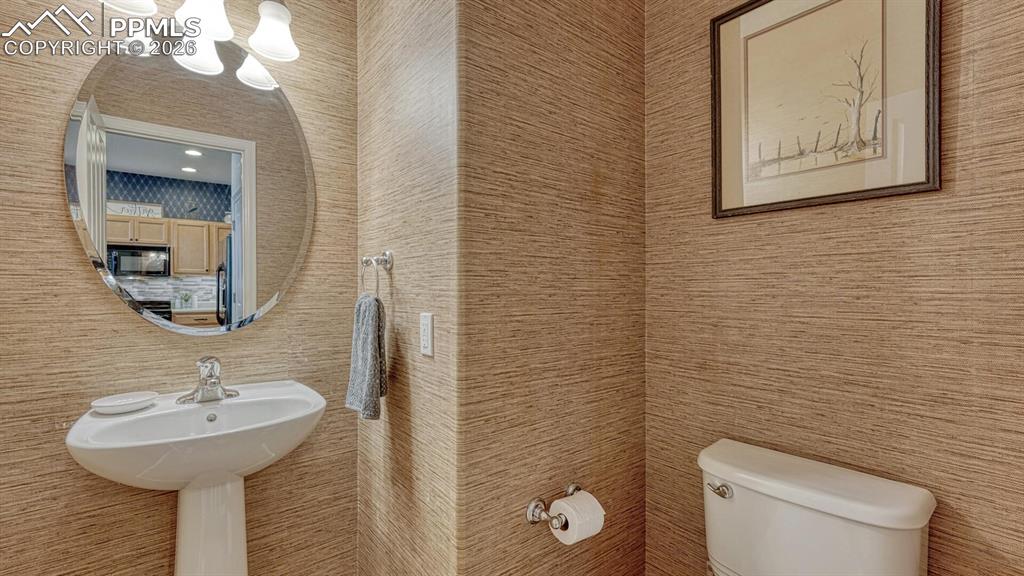 Image 11 of 24: Main level half bath with custom design!