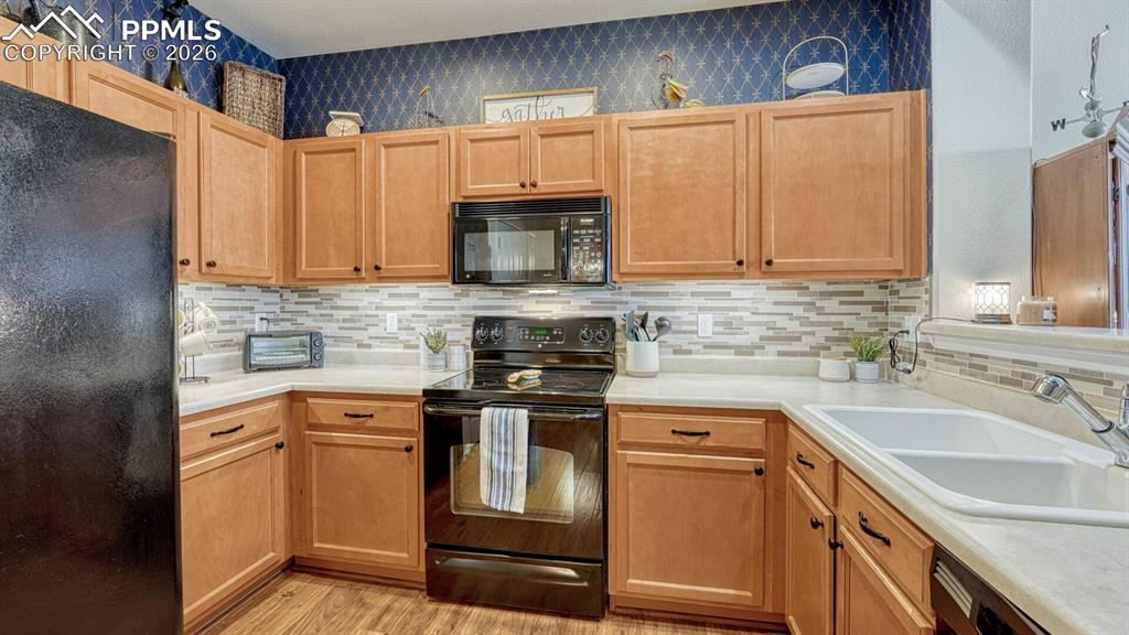 Image 2 of 24: Beautiful kitchen with designer and custom features
