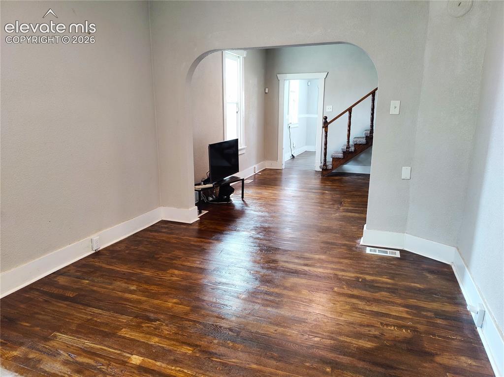 Image 4 of 13: Wood-finish flooring throughout, complemented by light-toned wall finishes 