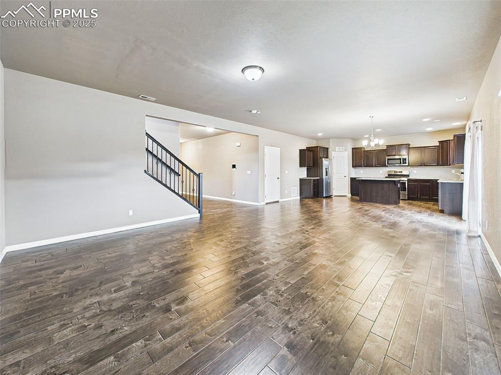 Image 10 of 50: Open-concept great room seamlessly connects to the large kitchen, perfect f