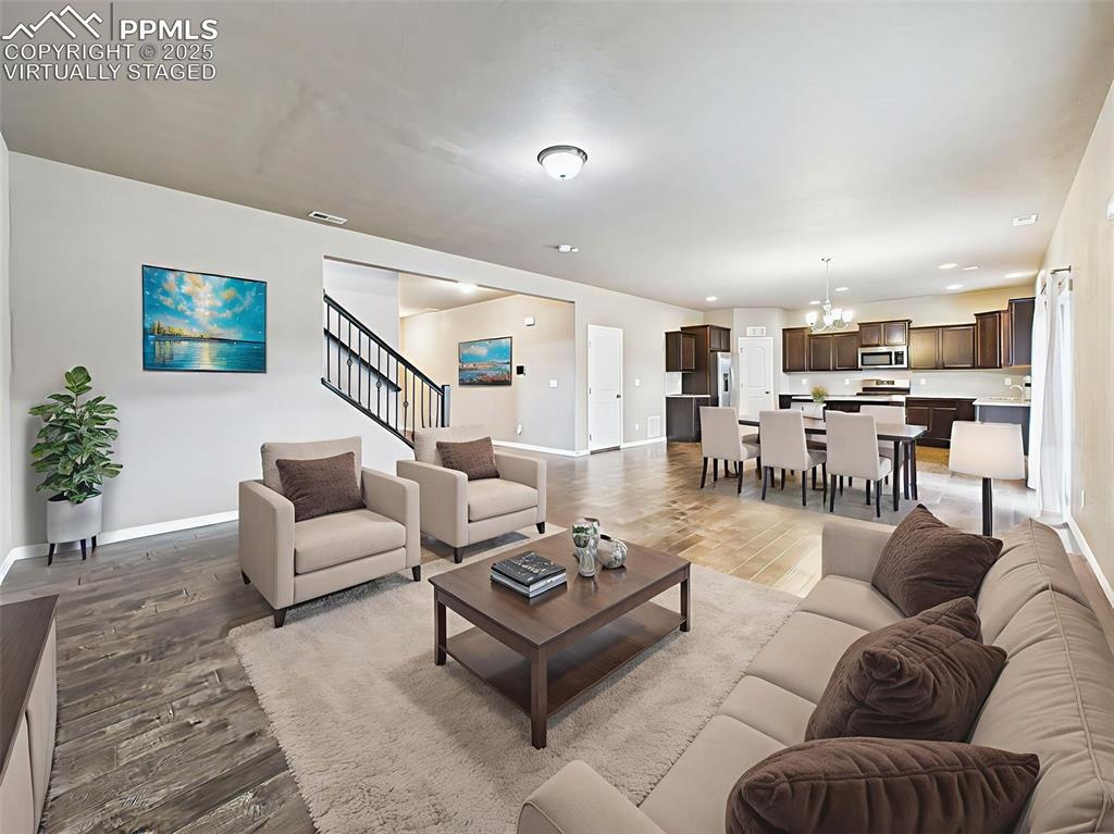 Image 11 of 50: virtually staged - image highlights the open layout, offering a comfortable