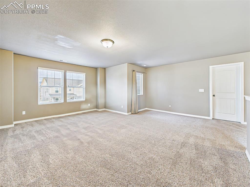 Image 21 of 50: Spacious upper-level loft offering flexibility for a second living room, ga