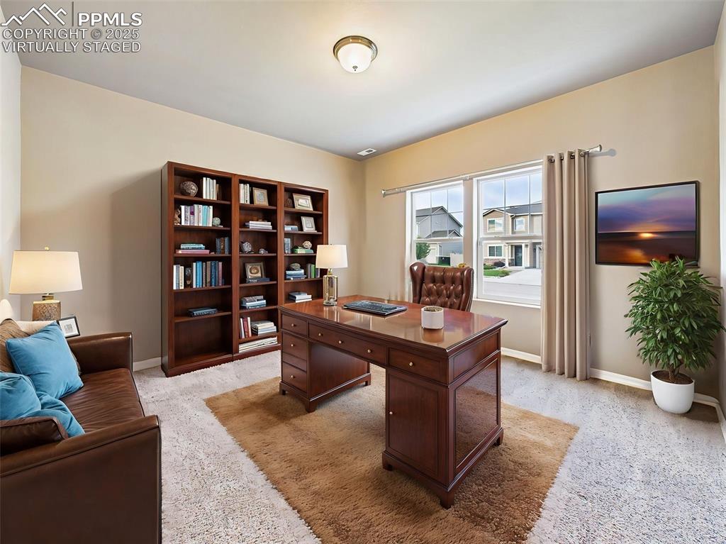Image 4 of 50: Virtually Staged - Shown here as a stylish home office with ample natural l