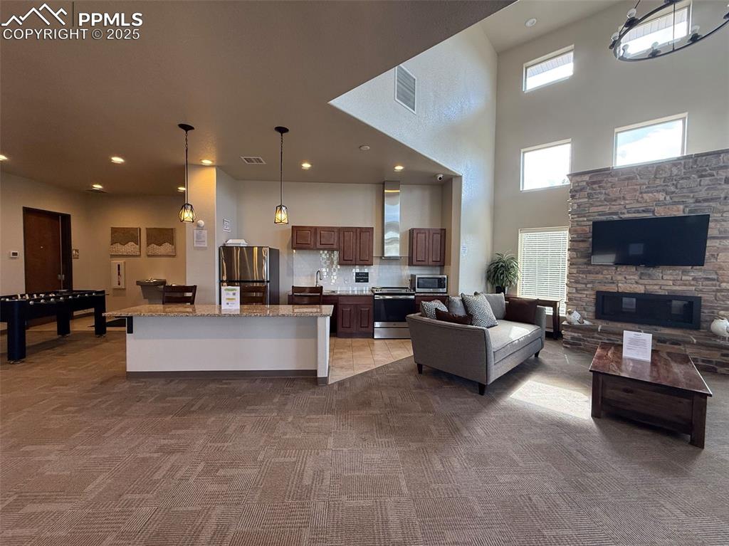 Image 48 of 50: Clubhouse Interior – Ventana’s clubhouse features a full kitchen, cozy seat