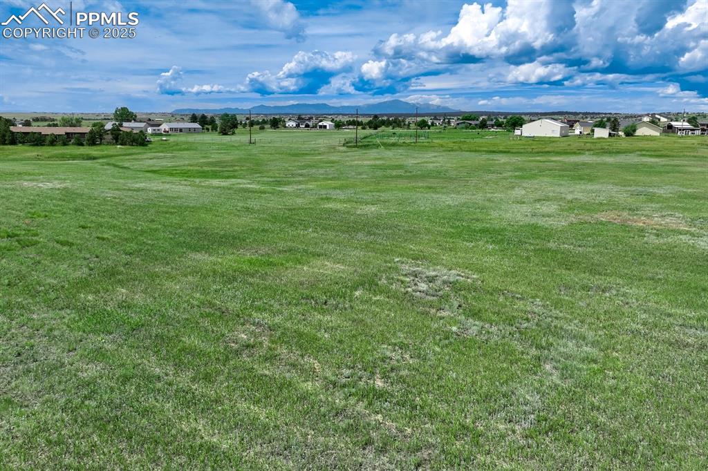 Image 18 of 20: View of grassy yard featuring a mountain view and a view of countryside