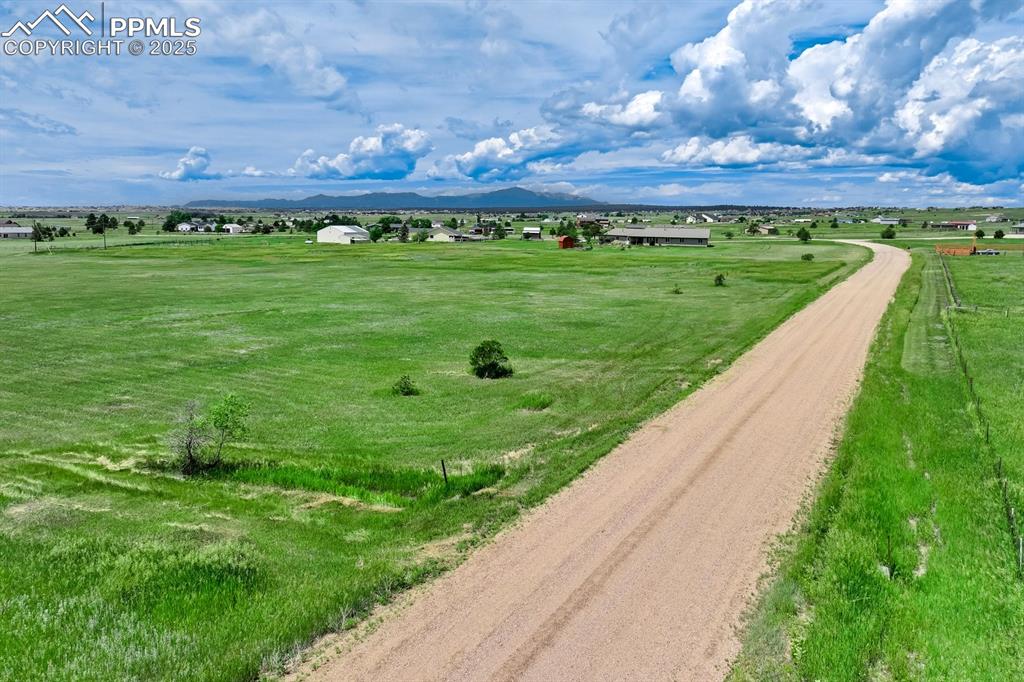 Image 3 of 20: View of rural area featuring a mountain backdrop