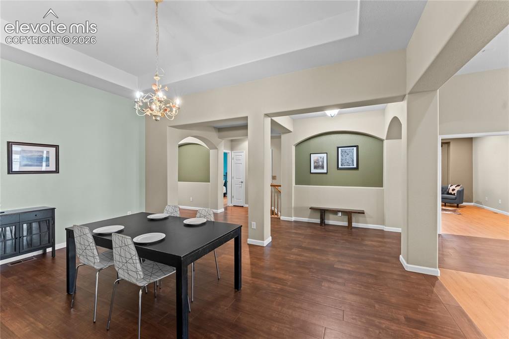 Image 11 of 36: Flex space staged for dinning room