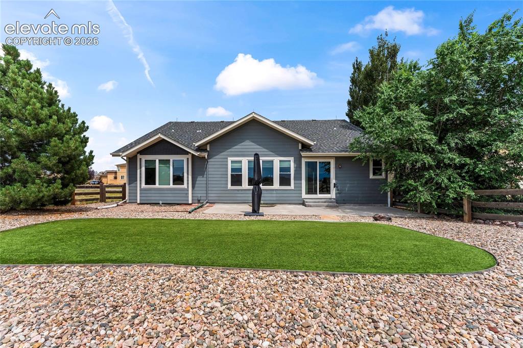 Image 2 of 36: Xeriscaped backyard with mountain views!