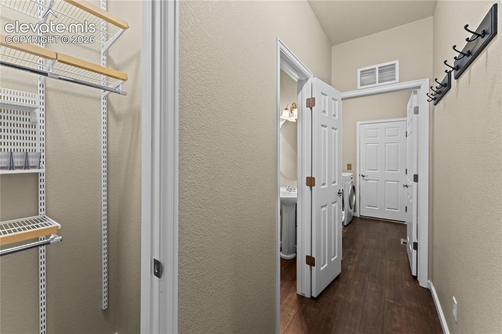 Image 24 of 36: Garage entry with half bathroom and closet and Laundry room