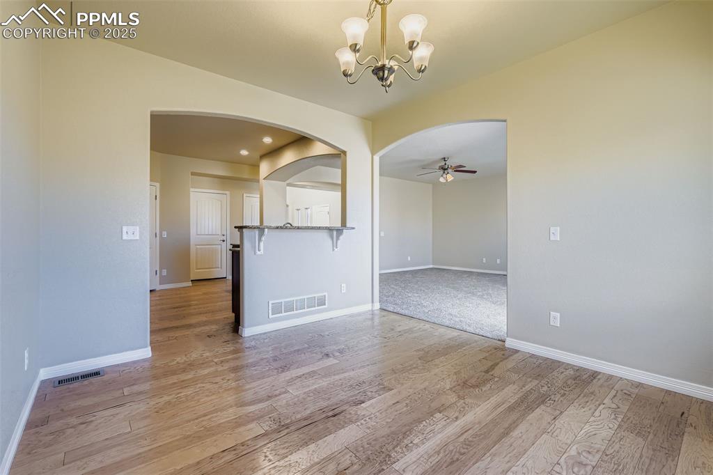 Image 11 of 49: dining room looking towards kitchen and living room