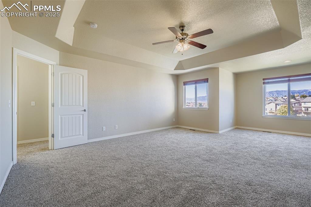 Image 16 of 49: Primary Bedroom with mountain views