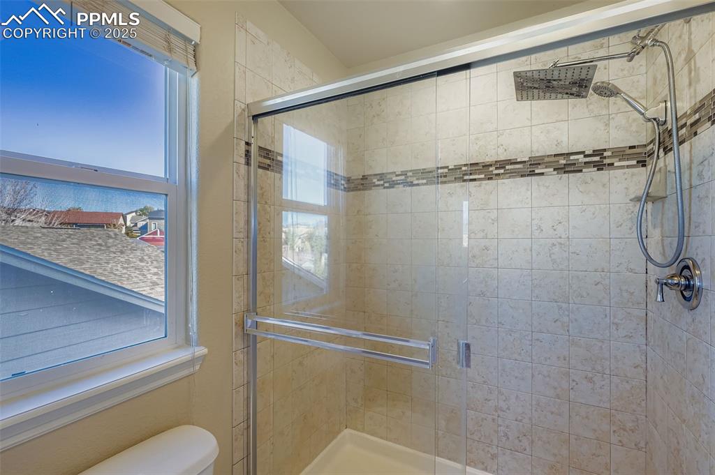 Image 20 of 49: Primary Bathroom standing shower