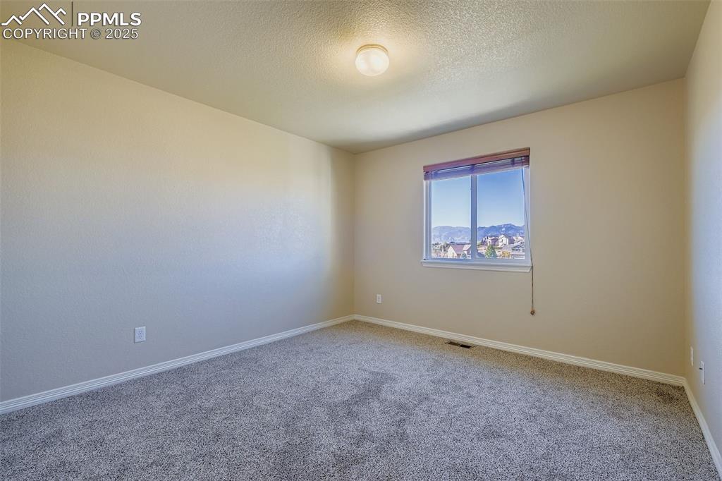 Image 22 of 49: Bedroom #2, between Laundry Room and Primary Bedroom