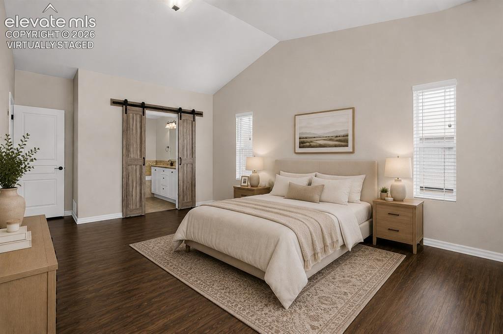 Image 19 of 50: Virtually Staged - Vaulted ceiling, wood-finish flooring, and a pair of bar
