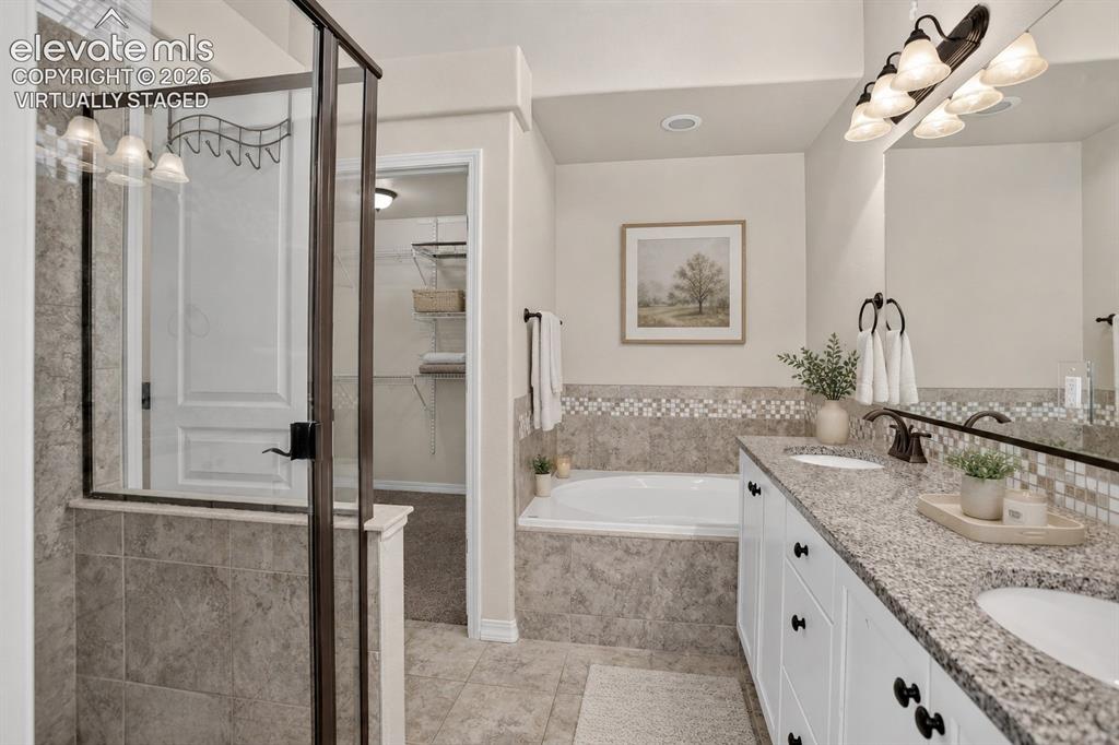 Image 22 of 50: Virtually Staged - Dual vanity with granite countertop and integrated sinks