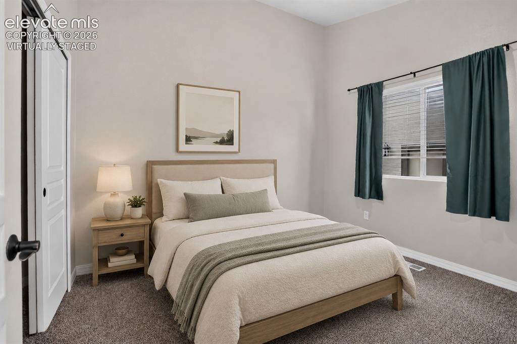 Image 26 of 50: Virtually Staged - Carpeted flooring, neutral wall paint, and a window with
