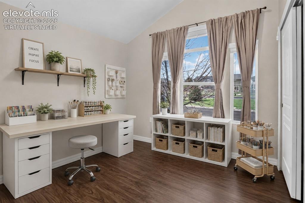 Image 28 of 50: Virtually Staged - Vaulted ceiling, durable wood-finish flooring, built-in