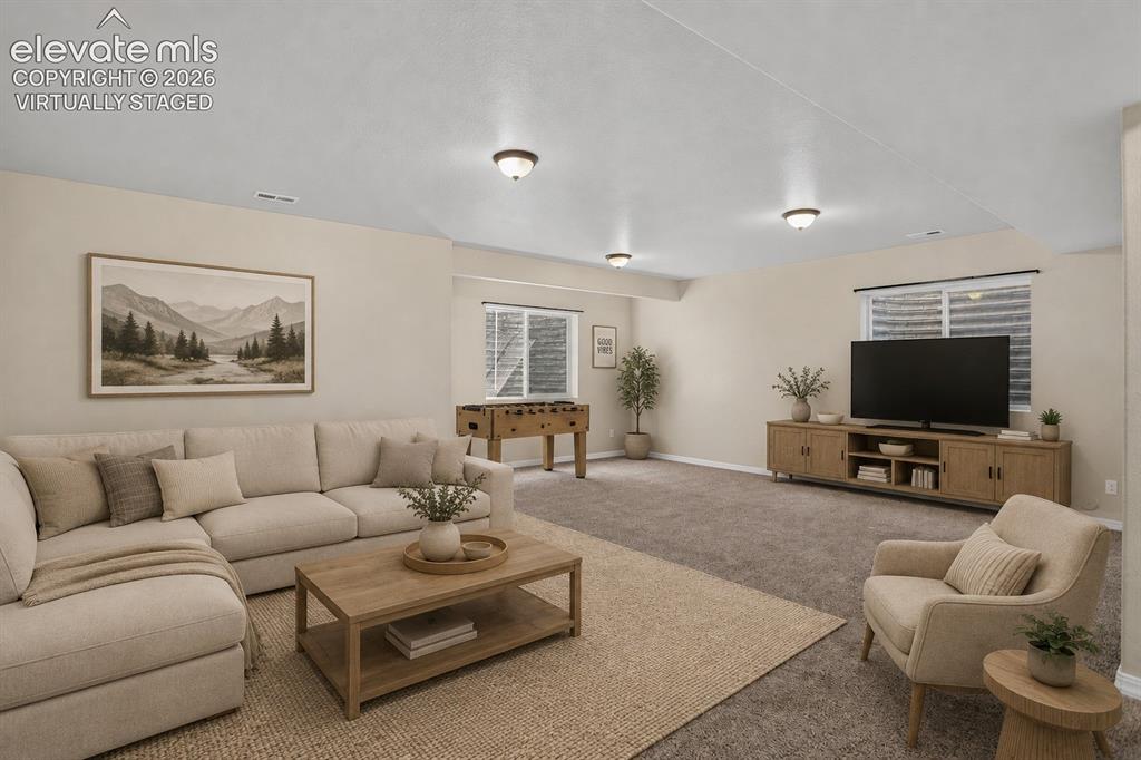 Image 33 of 50: Virtually Staged - Recessed ceiling lights, carpeted flooring, and window b
