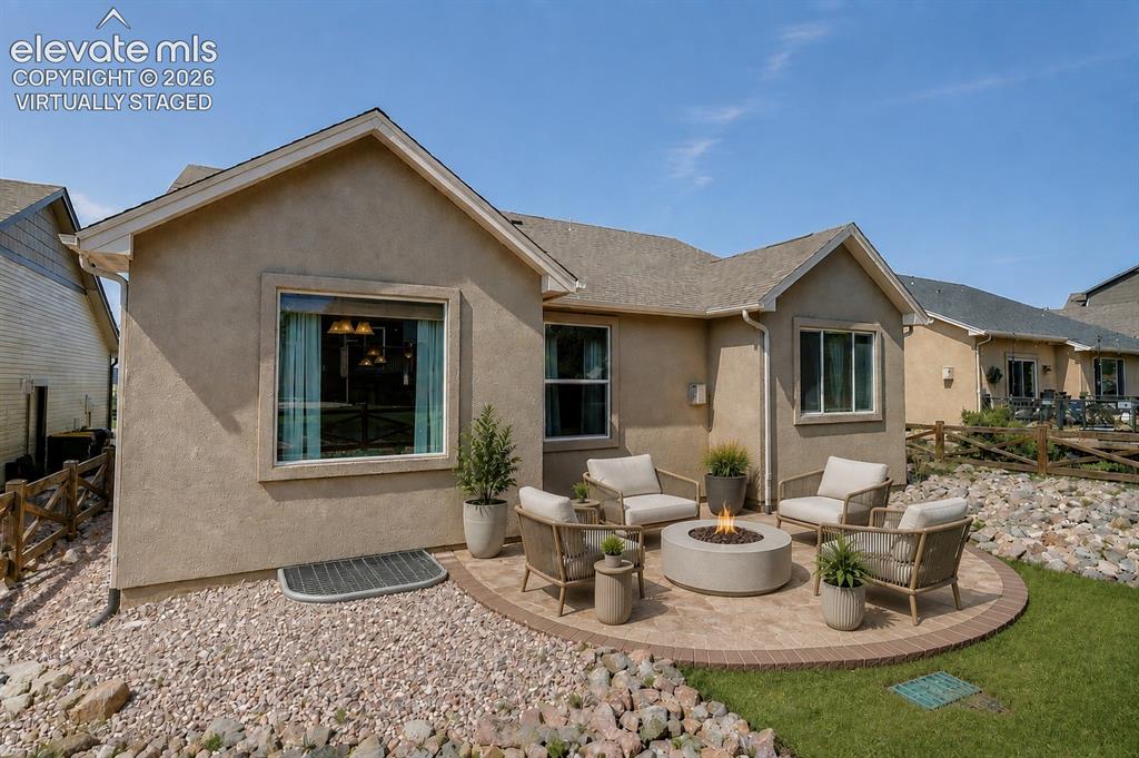 Image 45 of 50: Virtually Staged - Stucco exterior with a gable roofline, featuring an exte