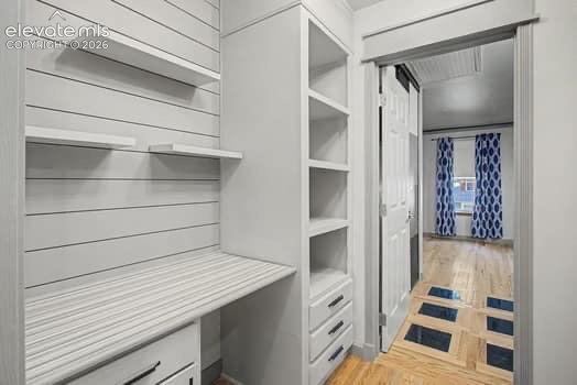 Image 10 of 20: Great shelving at the upstairs landing. Also a desk area for studying