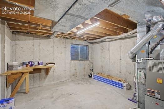 Image 19 of 20: Unfinished portion of the basement. This room includes the HVAC system and 