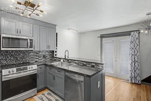 Image 5 of 20: Nice kitchen w/ stainless steel appliances and beautiful tile-work