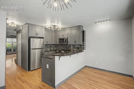 Image 8 of 20: You can also put bar-stools at the counter. So many possibilities!