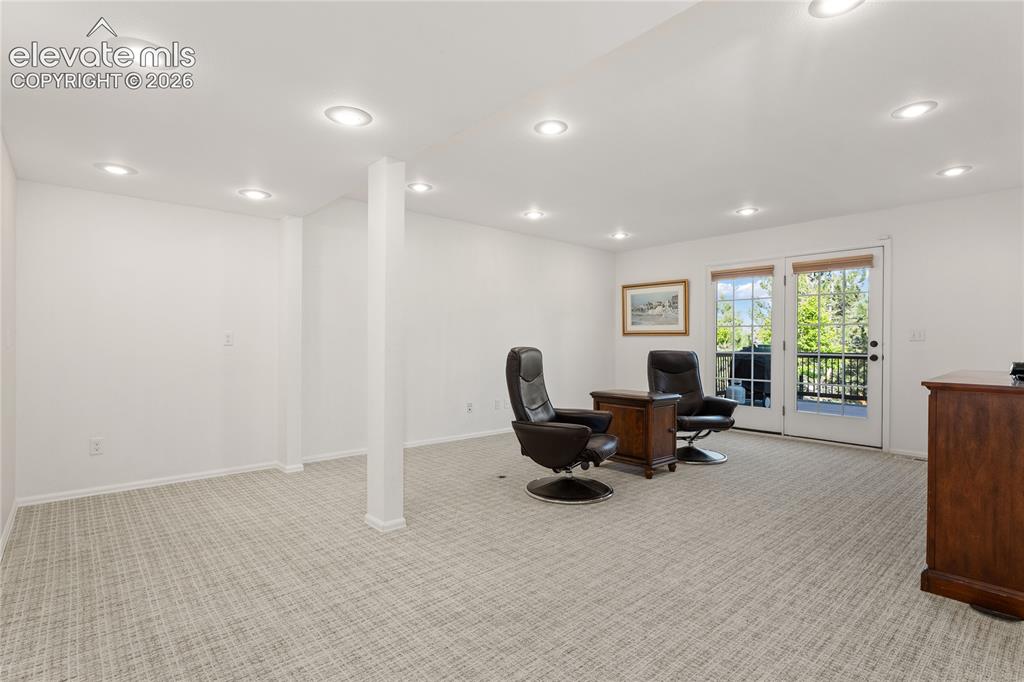 Image 18 of 42: Flex room on main for large primary suite conversion